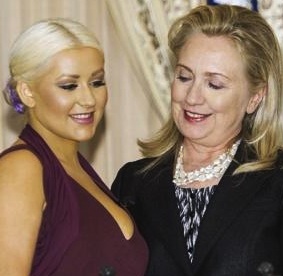 Former first lady Hillary Clinton was caught getting an eyeful of The Voice judge Christina Aguilera